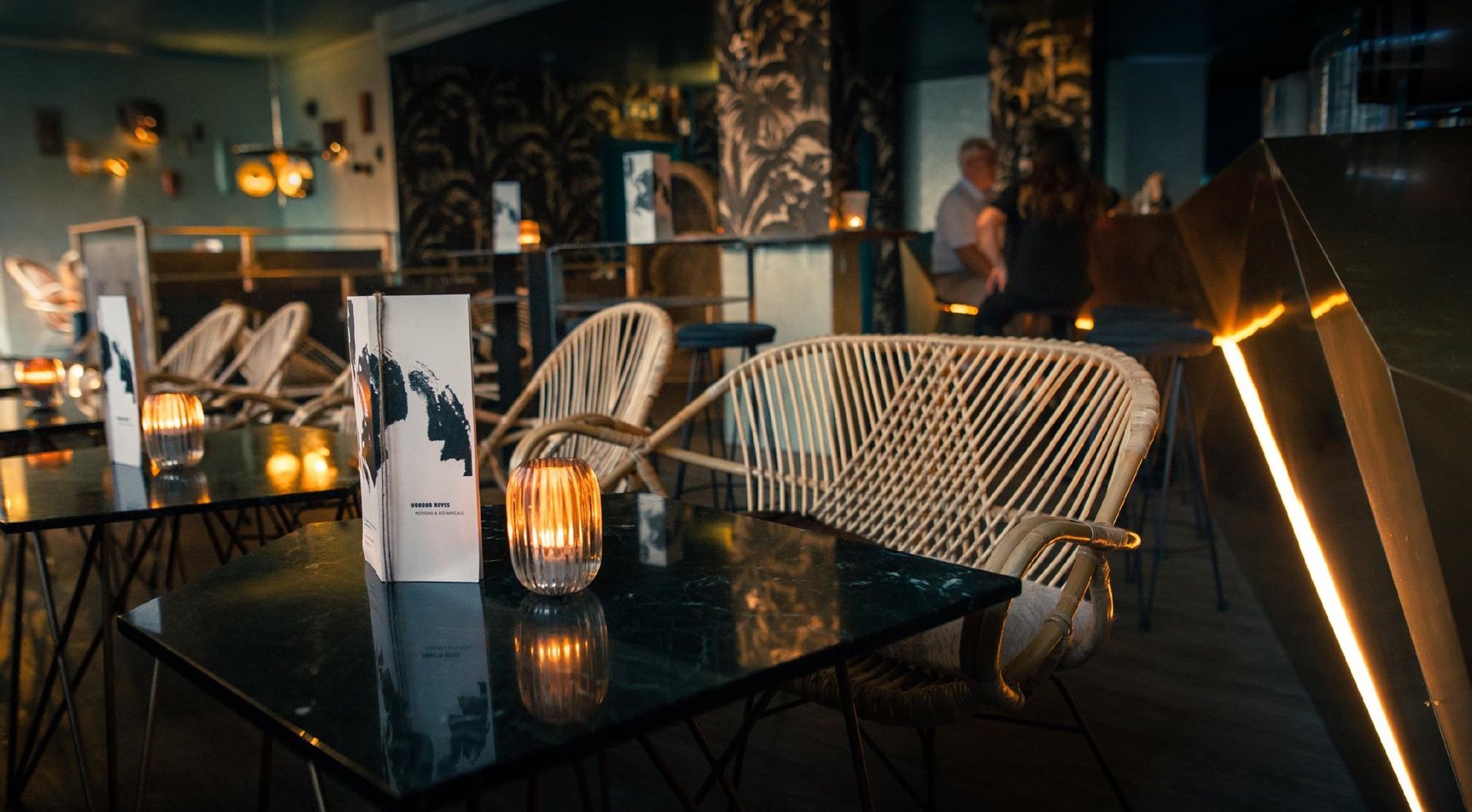 Voodoo Reyes, Geneva: rattan lounge chairs and candlelit tables
